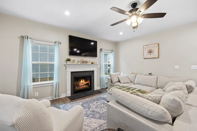 a kitchen with granite countertop kitchen island stainless steel appliances a sink stove and refrigerator