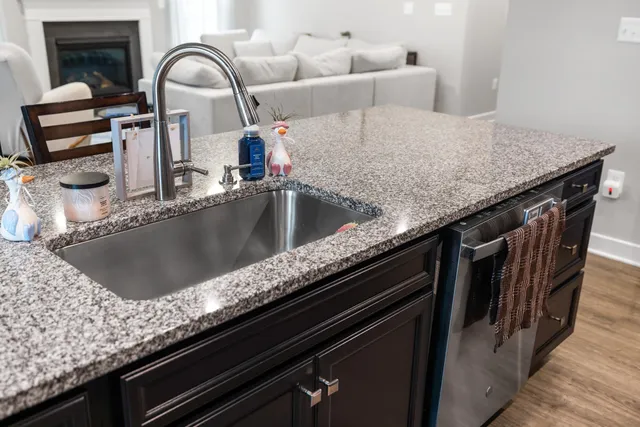a view of a hallway with a livingroom and entryway