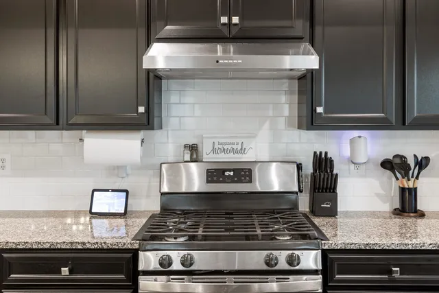 a spacious bedroom with a bed and a dresser