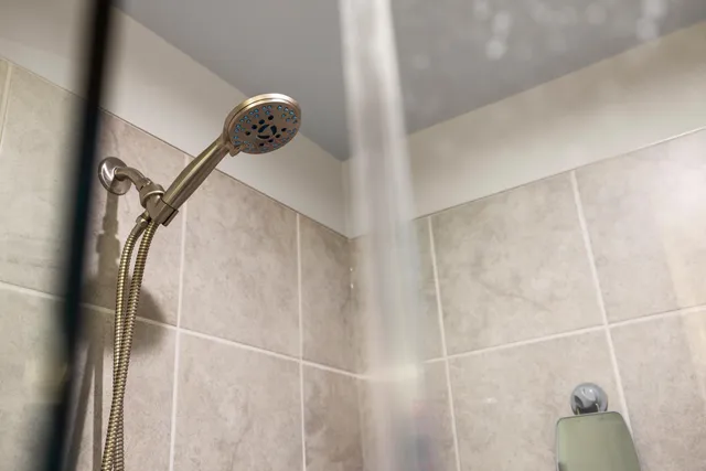 a living room with furniture a flat screen tv and a dresser