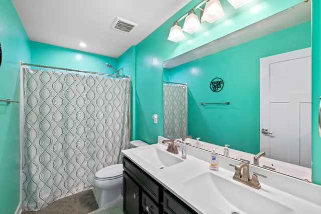 a bedroom with a bed and a walk in closet