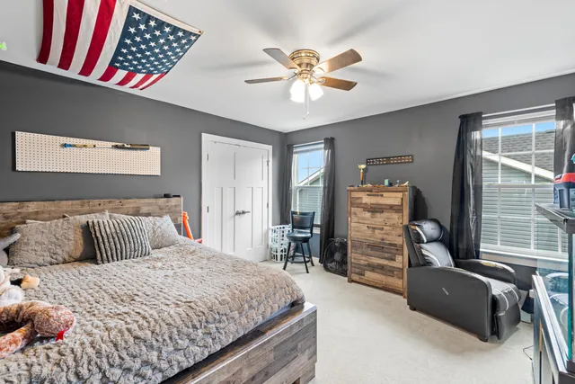 a balcony with furniture and a barbeque