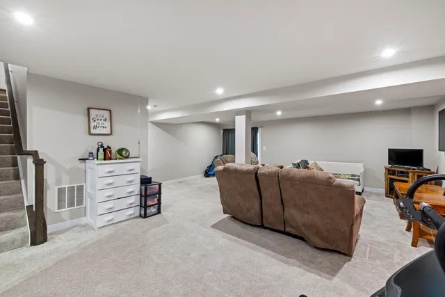 an aerial view of residential houses with a city view