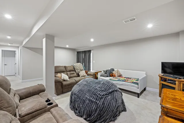 an aerial view of residential houses with outdoor space and city view