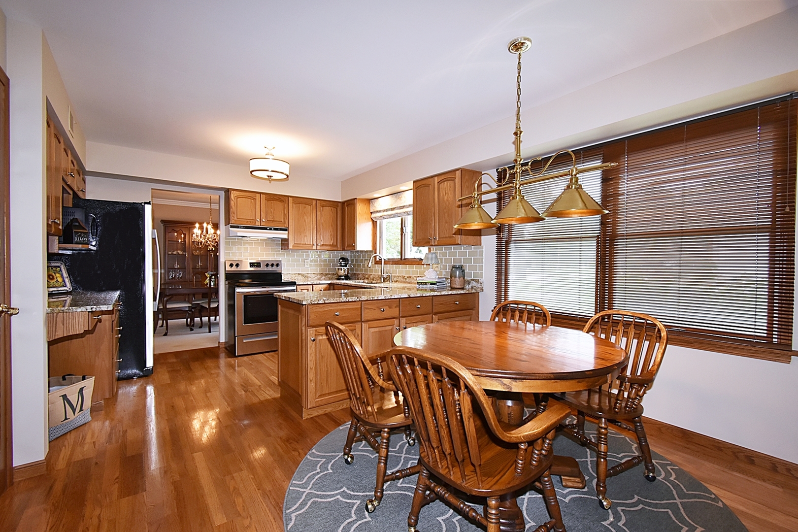 29 Manchester Way Aurora, IL 60506 - Photo 14 of 38 a dining room with furniture window and wooden floor