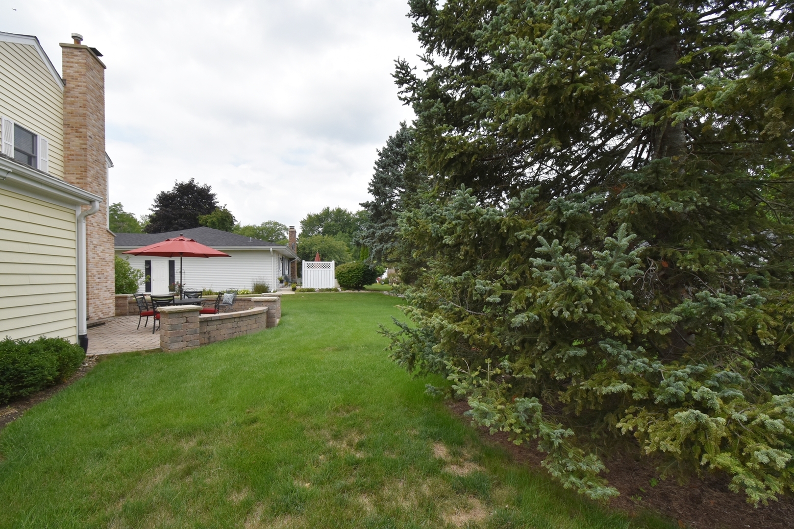 29 Manchester Way Aurora, IL 60506 - Photo 32 of 38 a view of a house with a yard and sitting area