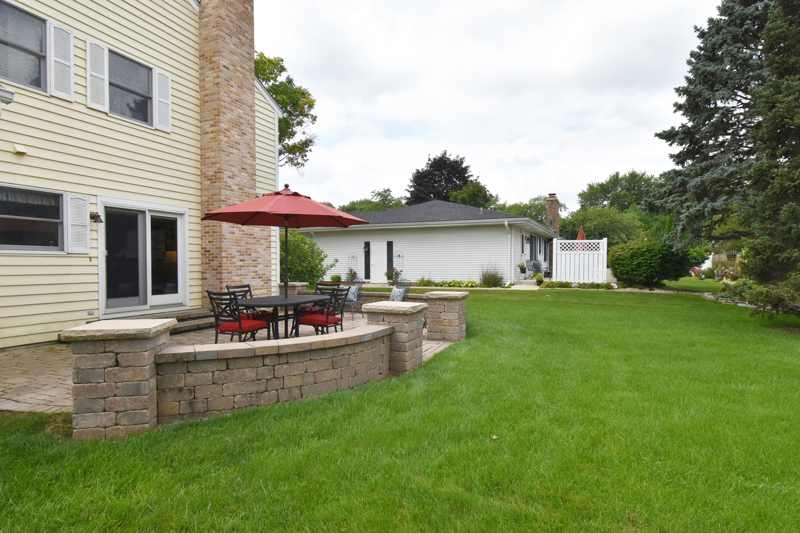 29 Manchester Way Aurora, IL 60506 - Photo 33 of 38 a view of a house with a patio and a yard