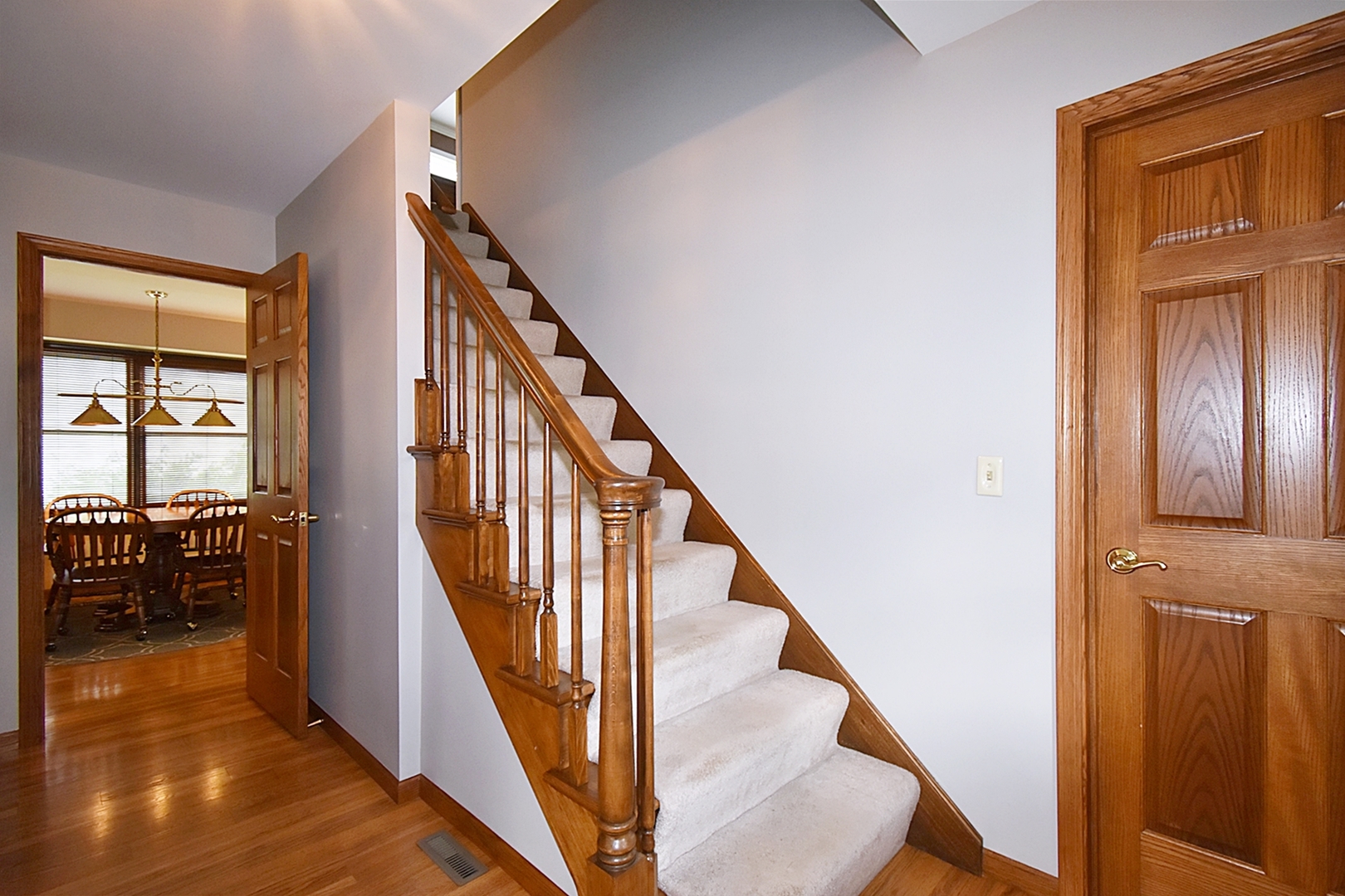 29 Manchester Way Aurora, IL 60506 - Photo 5 of 38 a view of an entryway with wooden floor and stairs
