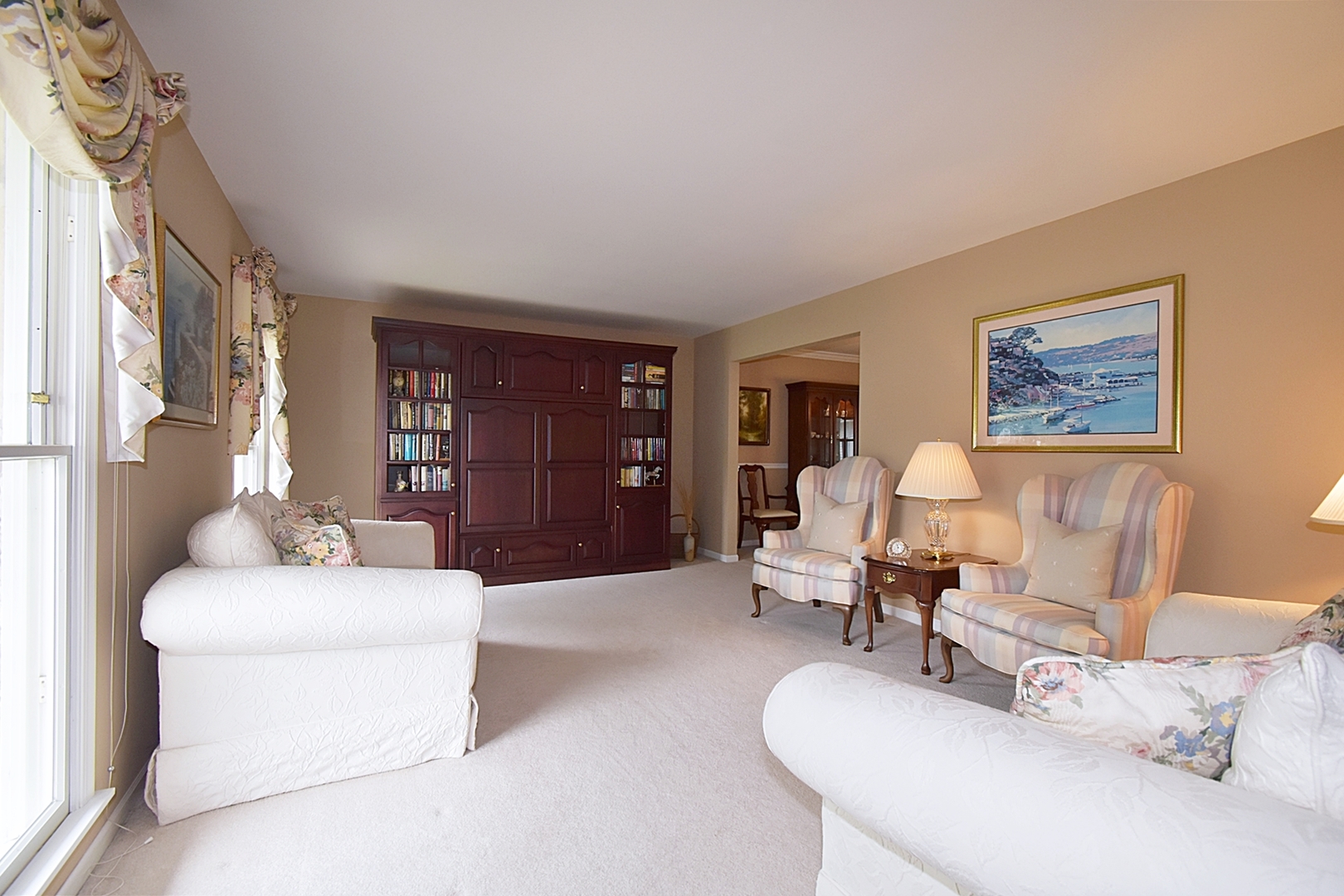 29 Manchester Way Aurora, IL 60506 - Photo 7 of 38 a living room with furniture a desk and a chair with the wooden floor