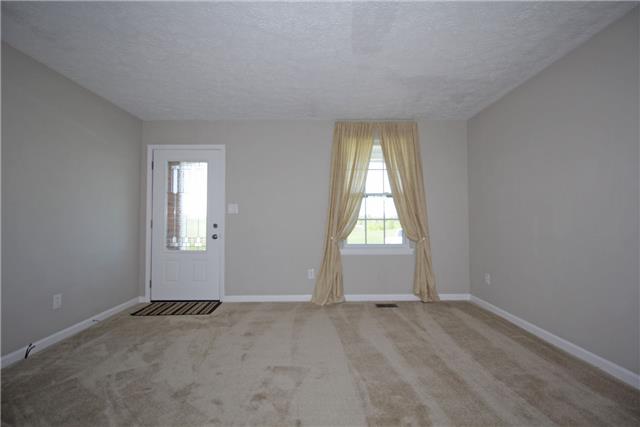 7813 Bob Carr Road Cross Plains, TN 37049 - Photo 8 of 8 an empty room with windows