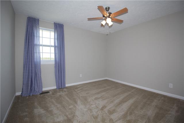 7813 Bob Carr Road Cross Plains, TN 37049 - Photo 4 of 8 an empty room with window and a ceiling fan