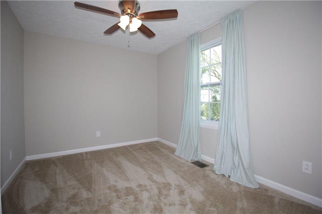7813 Bob Carr Road Cross Plains, TN 37049 - Photo 5 of 8 an empty room with windows and fan