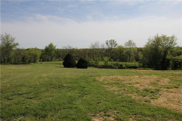 7813 Bob Carr Road Cross Plains, TN 37049 - Photo 7 of 8 a view of a field with an trees in the background