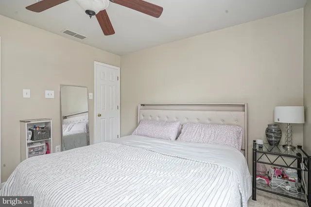 a bedroom with a bed and closet