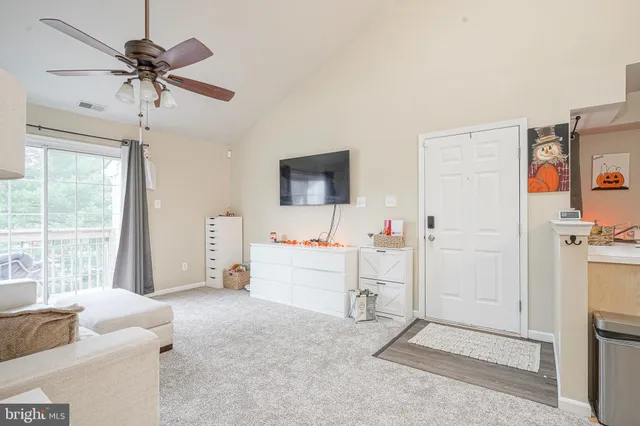 a view of livingroom with furniture and ceiling fan