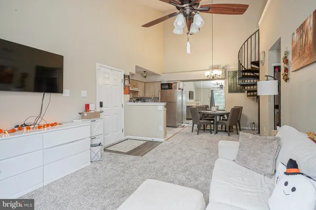 a work room with furniture and a flat screen tv