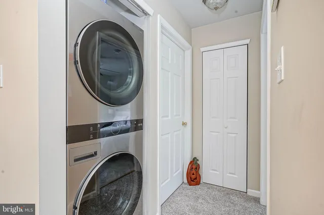 a view of livingroom with washer and dryer