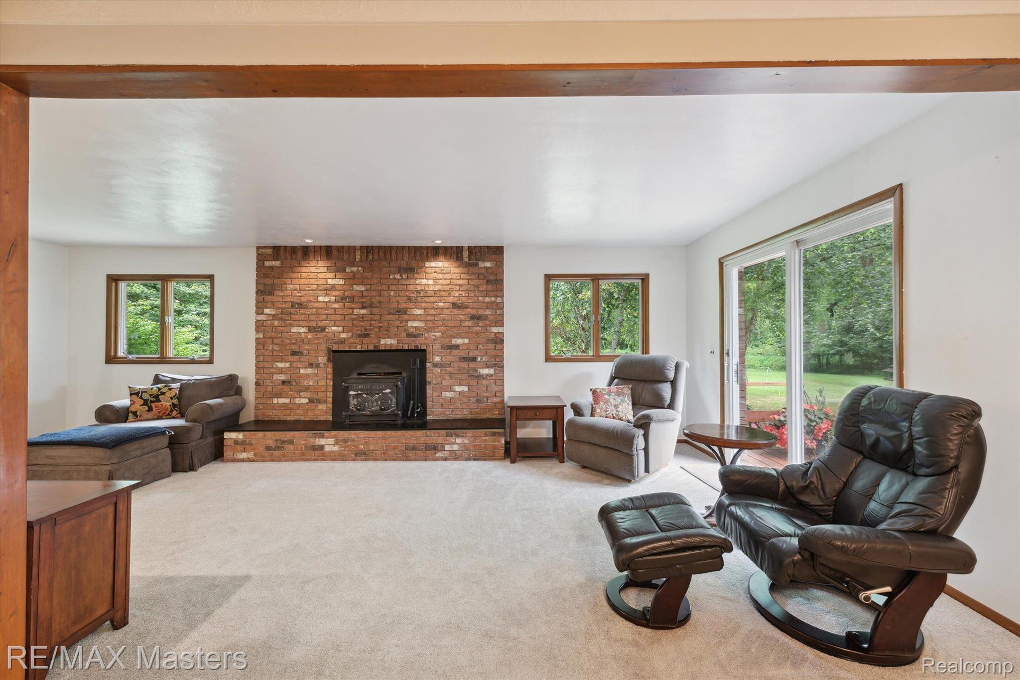 21610 Otter Road Belleville, MI 48111 - Photo 9 of 35 Family Room Has Wood Burning Stove And Doorwall