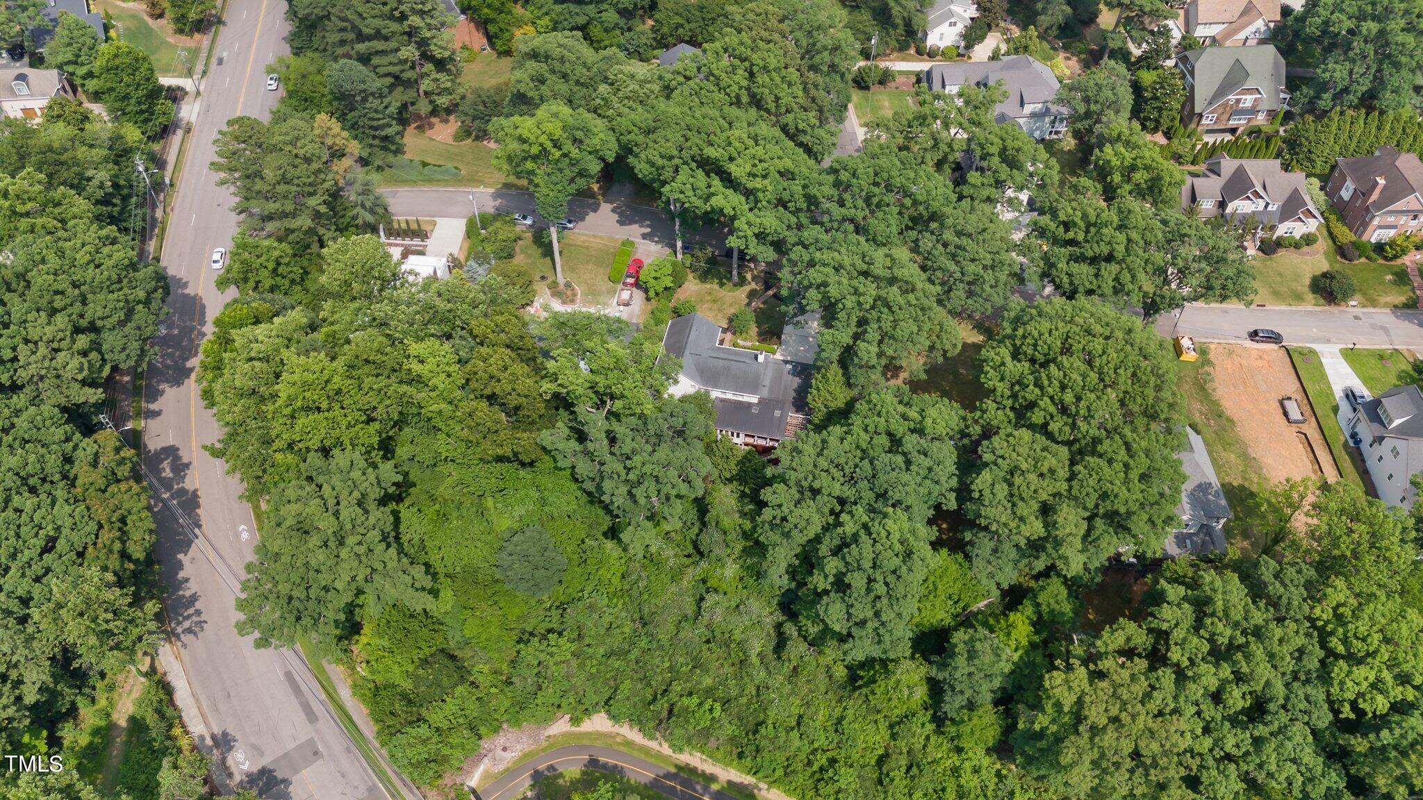 1817 Stillwater Drive Raleigh, NC 27607 - Photo 11 of 58 an aerial view of a house with a yard