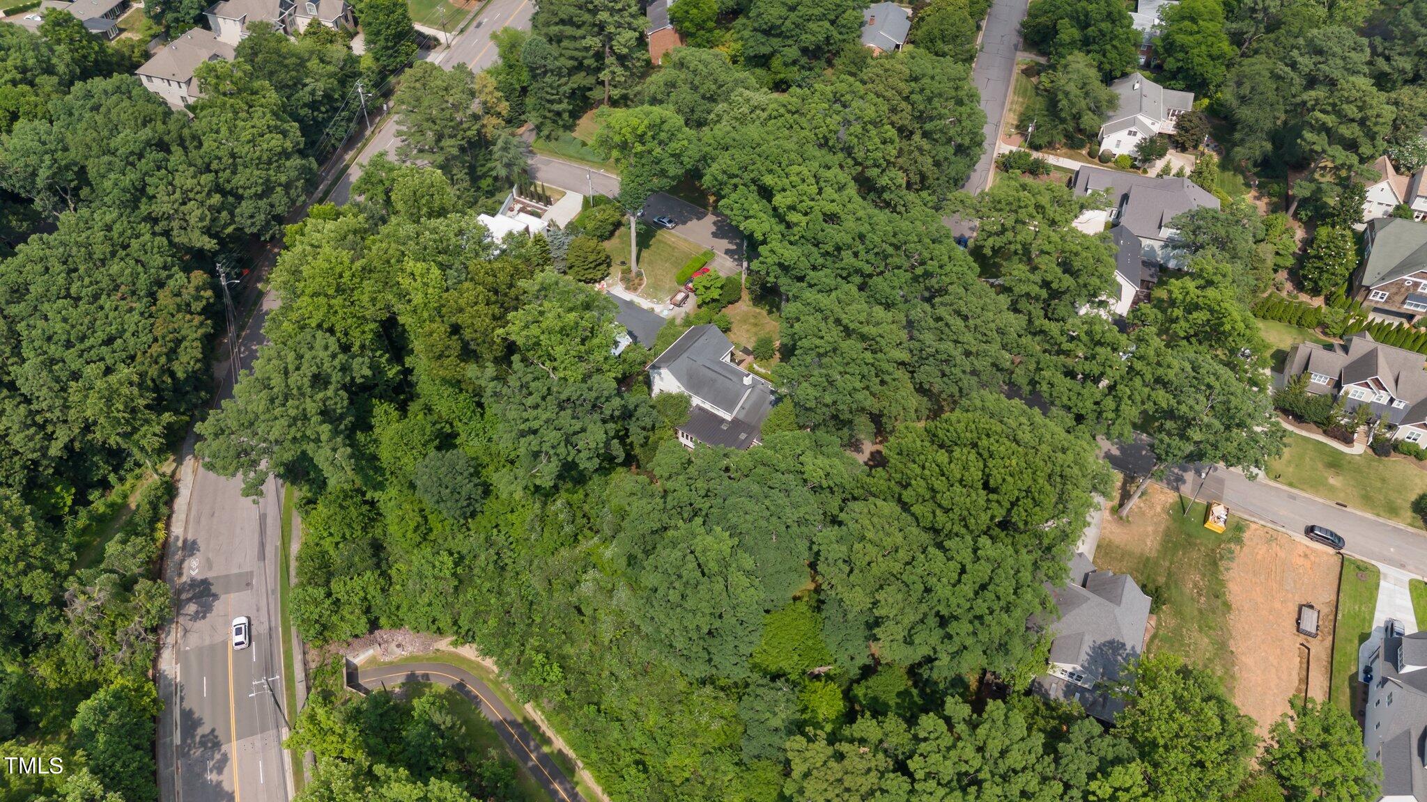 1817 Stillwater Drive Raleigh, NC 27607 - Photo 12 of 58 an aerial view of residential houses with outdoor space and trees
