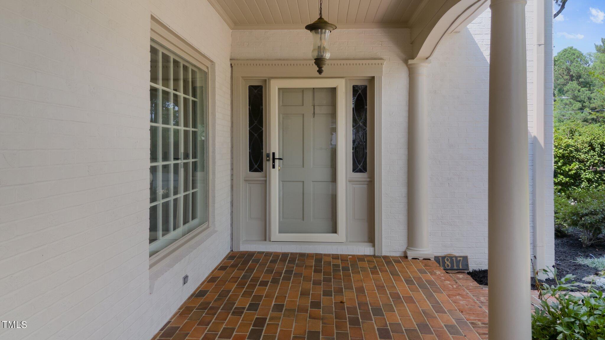 1817 Stillwater Drive Raleigh, NC 27607 - Photo 2 of 58 a view of front door with wooden floor