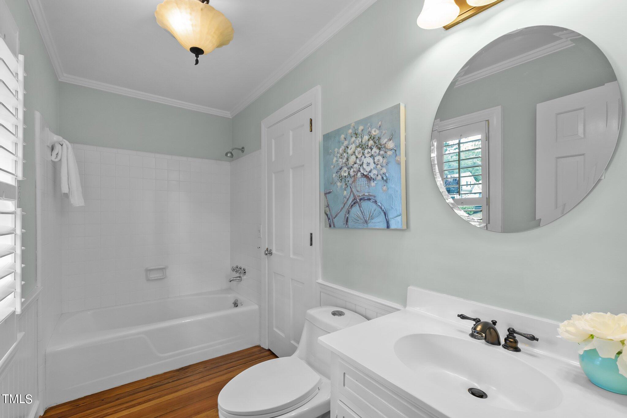 1817 Stillwater Drive Raleigh, NC 27607 - Photo 31 of 58 a bathroom with a sink toilet and shower