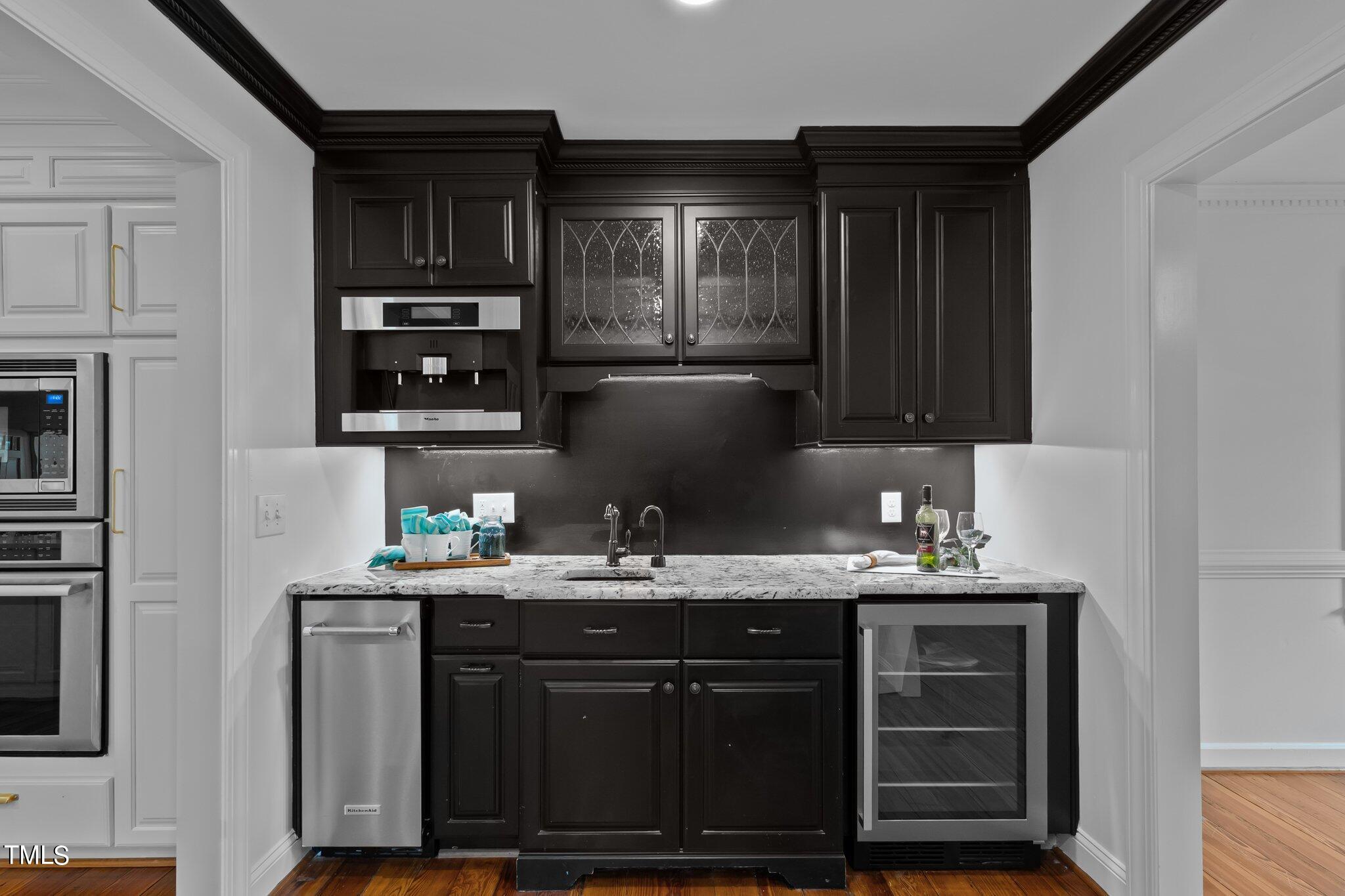 1817 Stillwater Drive Raleigh, NC 27607 - Photo 35 of 58 a kitchen with a sink and cabinets