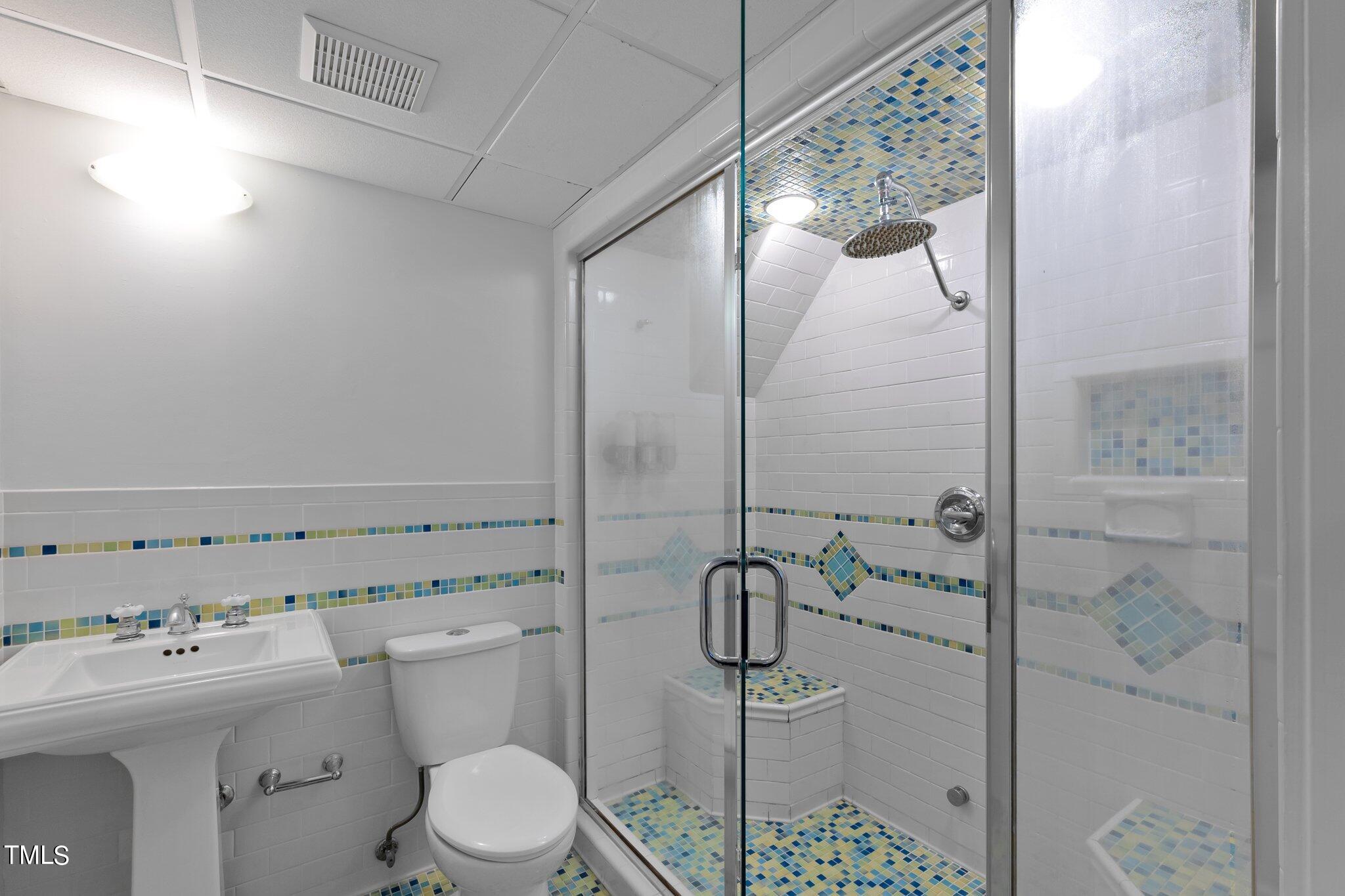 1817 Stillwater Drive Raleigh, NC 27607 - Photo 51 of 58 a bathroom with a sink mirror and toilet