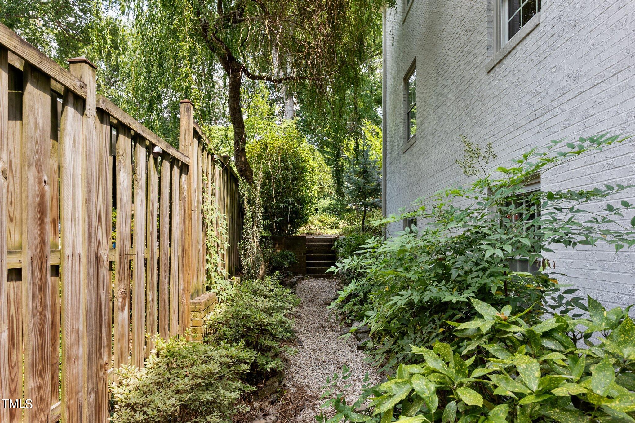 1817 Stillwater Drive Raleigh, NC 27607 - Photo 53 of 58 a view of a backyard with pathway