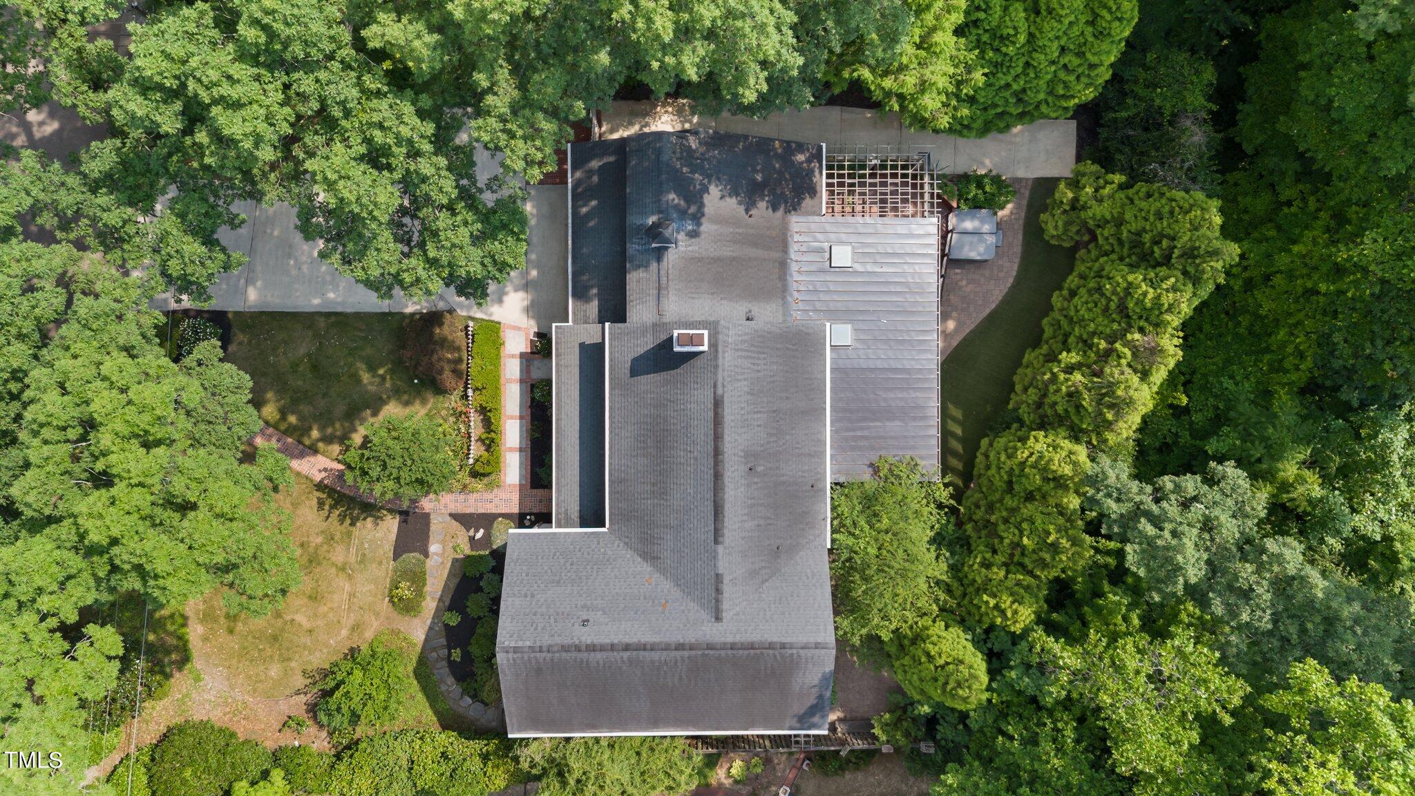 1817 Stillwater Drive Raleigh, NC 27607 - Photo 7 of 58 an aerial view of a house with garden space and a fountain