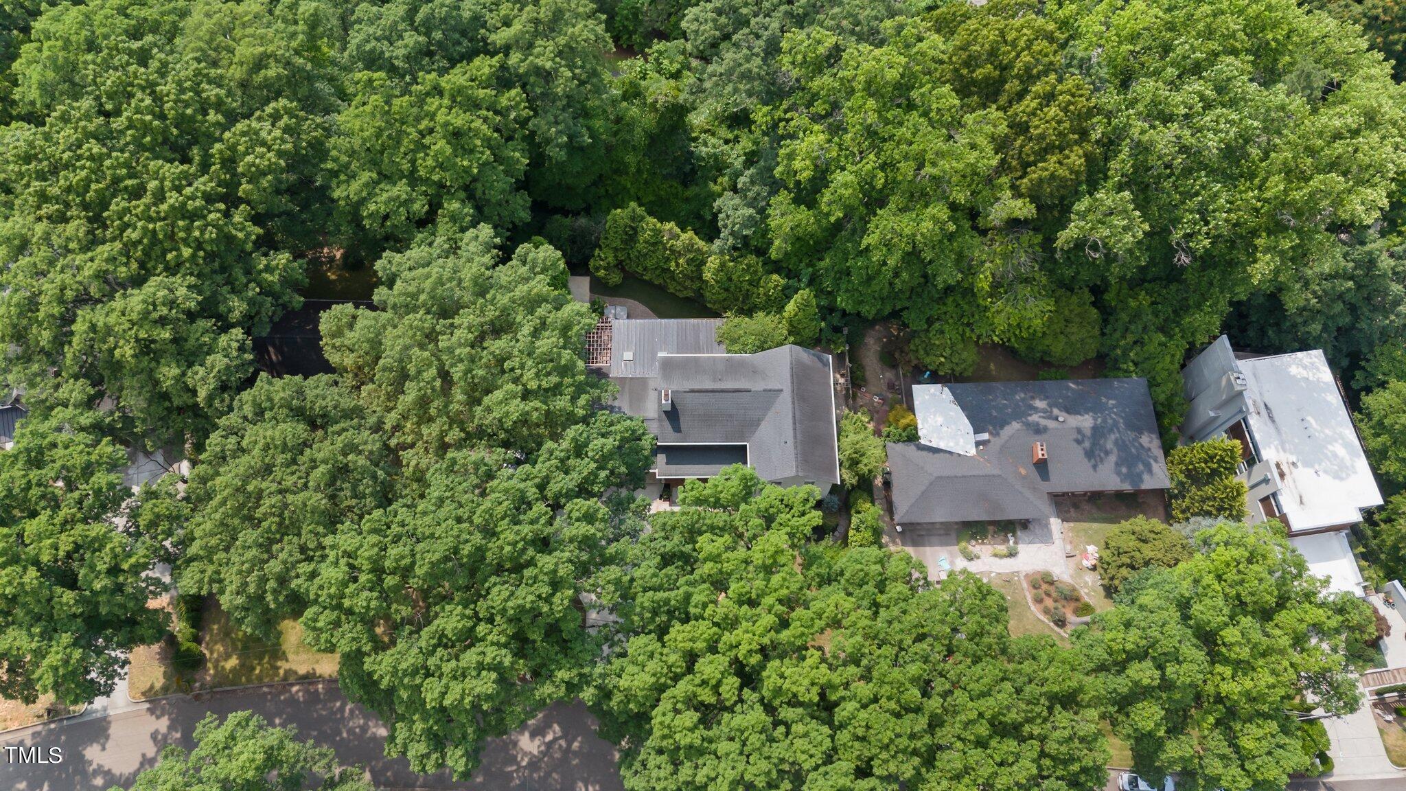 1817 Stillwater Drive Raleigh, NC 27607 - Photo 10 of 58 an aerial view of a house with a yard and trees