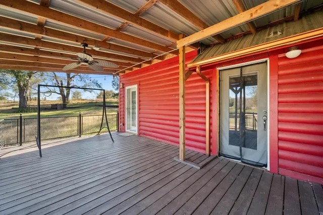 a view of outdoor space and wooden deck