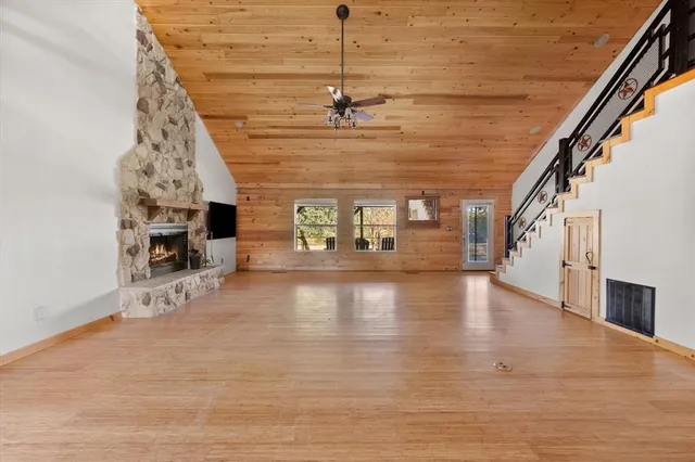 a view of a hall with wooden floor