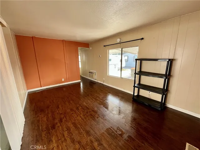 a kitchen with granite countertop a sink a stove and cabinets