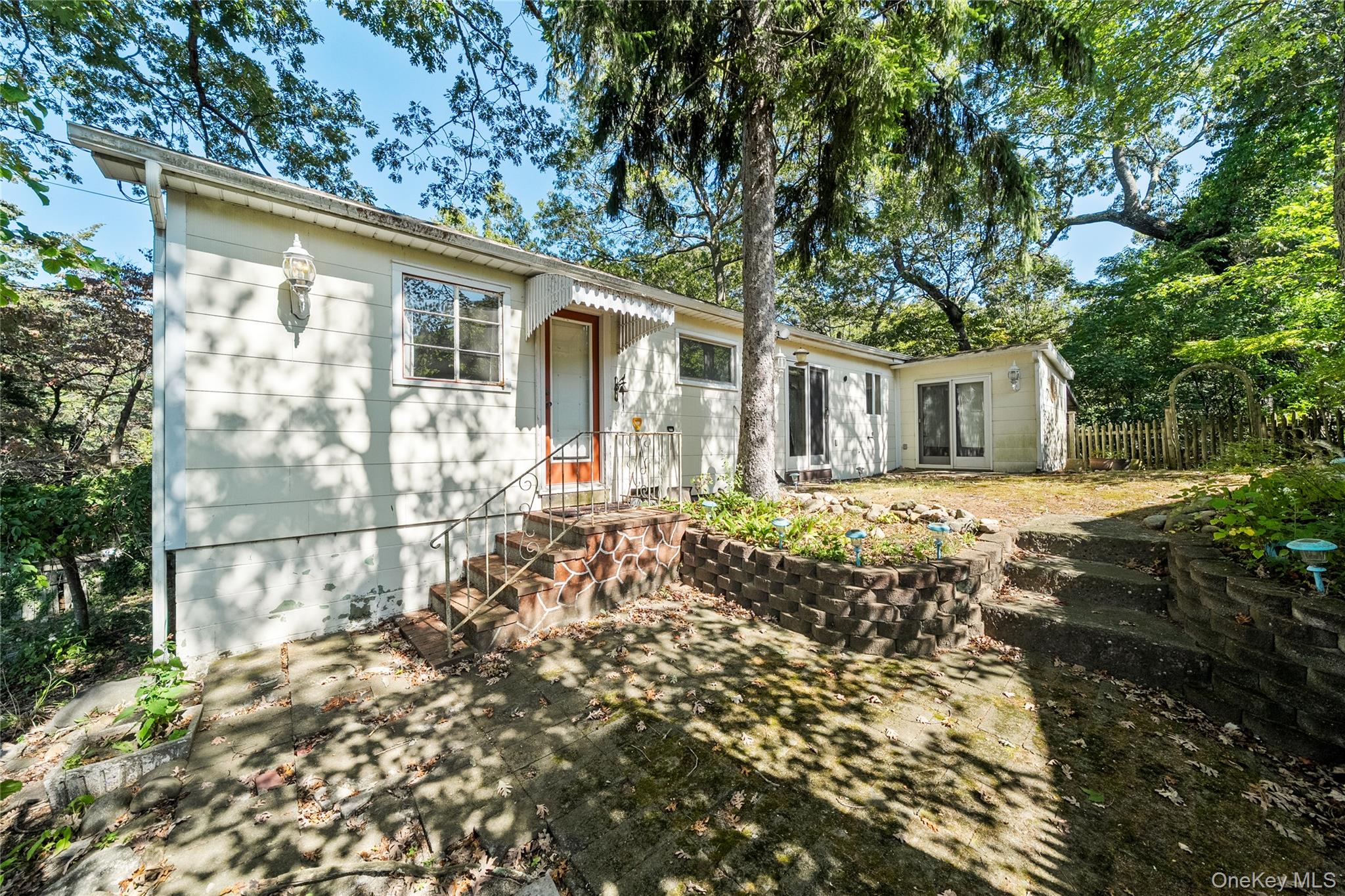 14 Whitestone Road Sound Beach, NY 11789 - Photo 1 of 1 a front view of a house with a garden