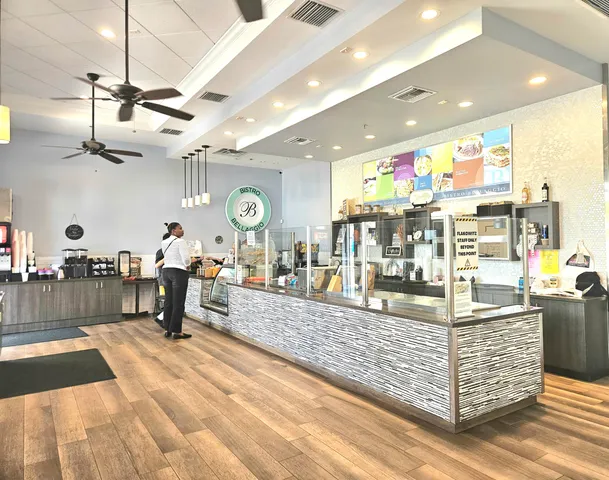 a view of a living room and kitchen