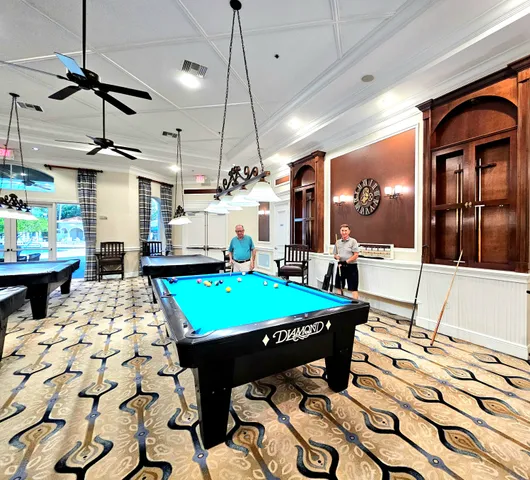 a room with lots of table and chairs