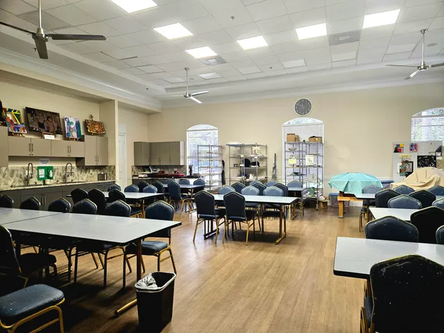 a living room with lots of furniture and a wooden floor