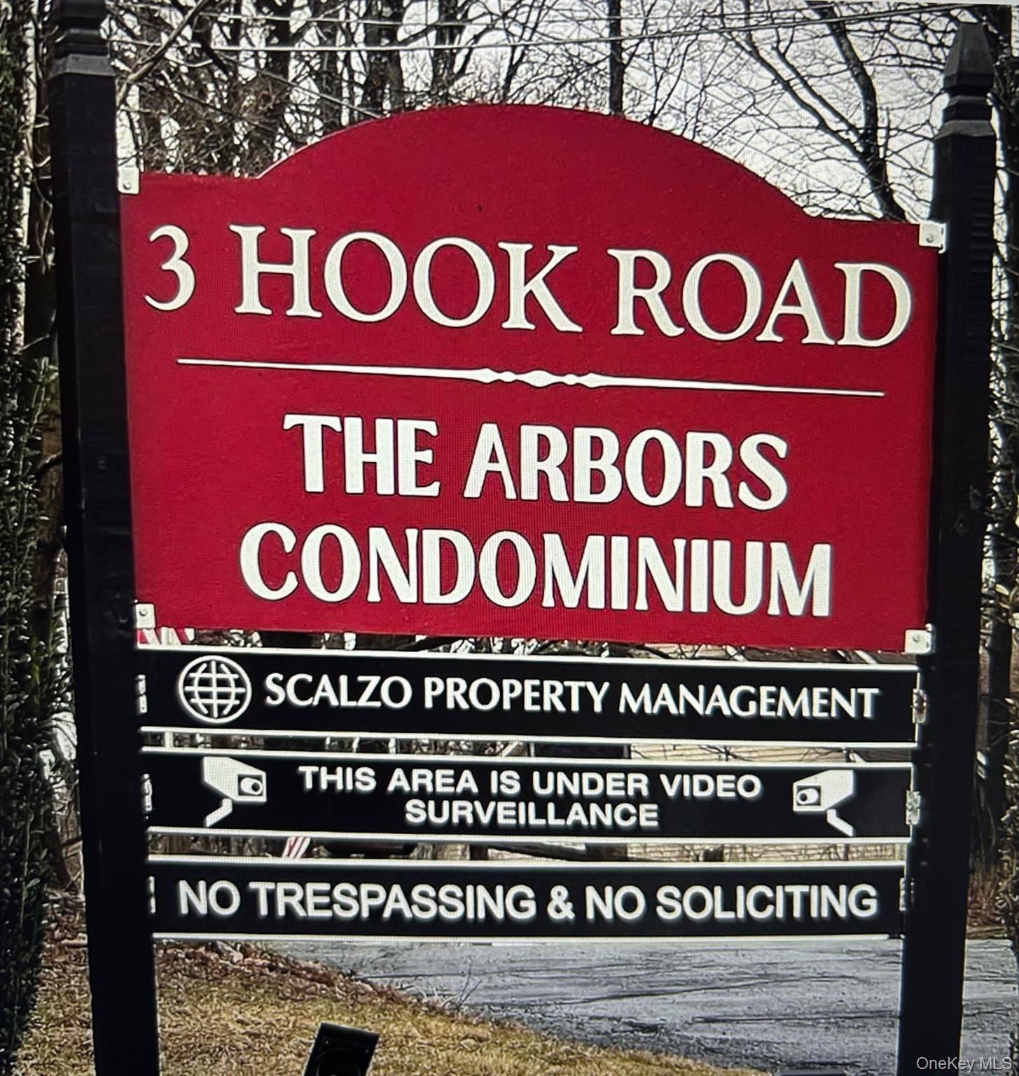 a sign on a red sign board