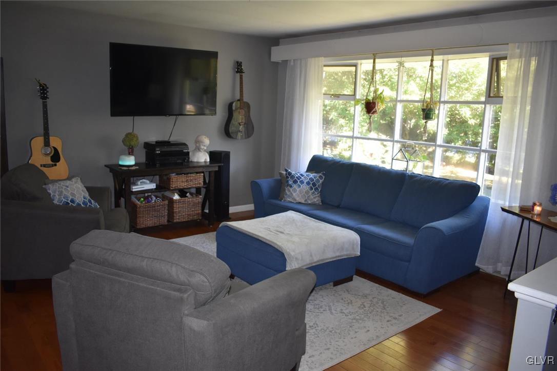 567 Cherry Hill Road Nazareth, PA 18064 - Photo 2 of 14 a living room with furniture and a flat screen tv
