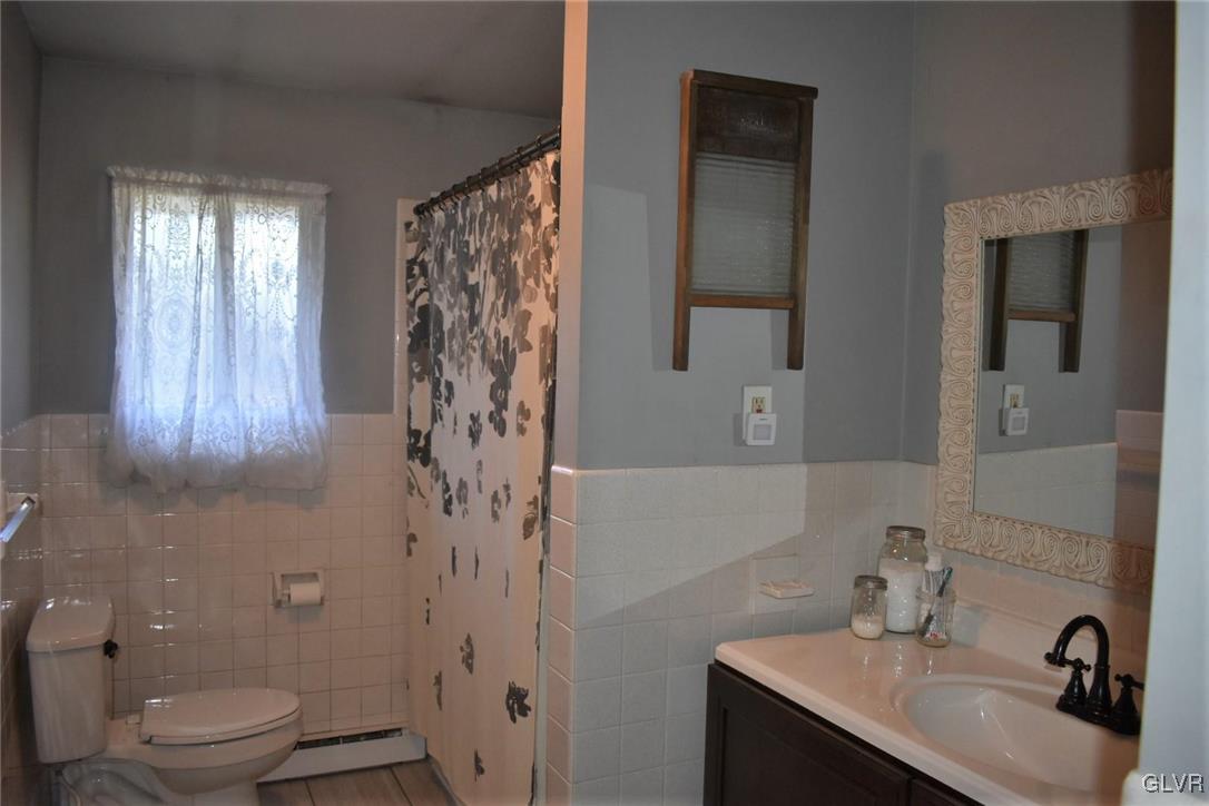 567 Cherry Hill Road Nazareth, PA 18064 - Photo 9 of 14 a bathroom with a sink a toilet and shower