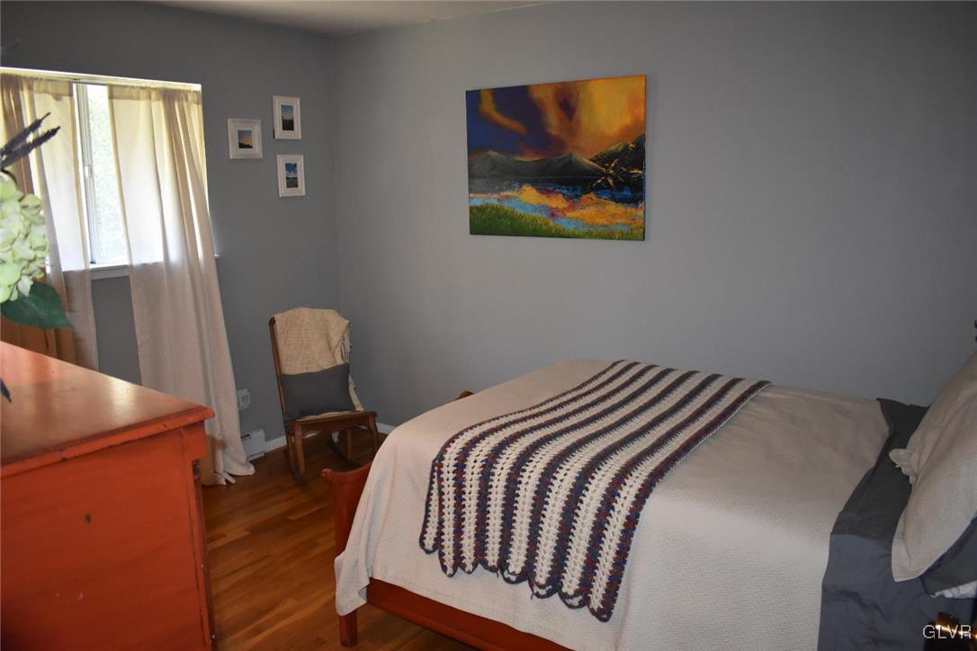 567 Cherry Hill Road Nazareth, PA 18064 - Photo 10 of 14 a bedroom with a bed and a painting on the wall