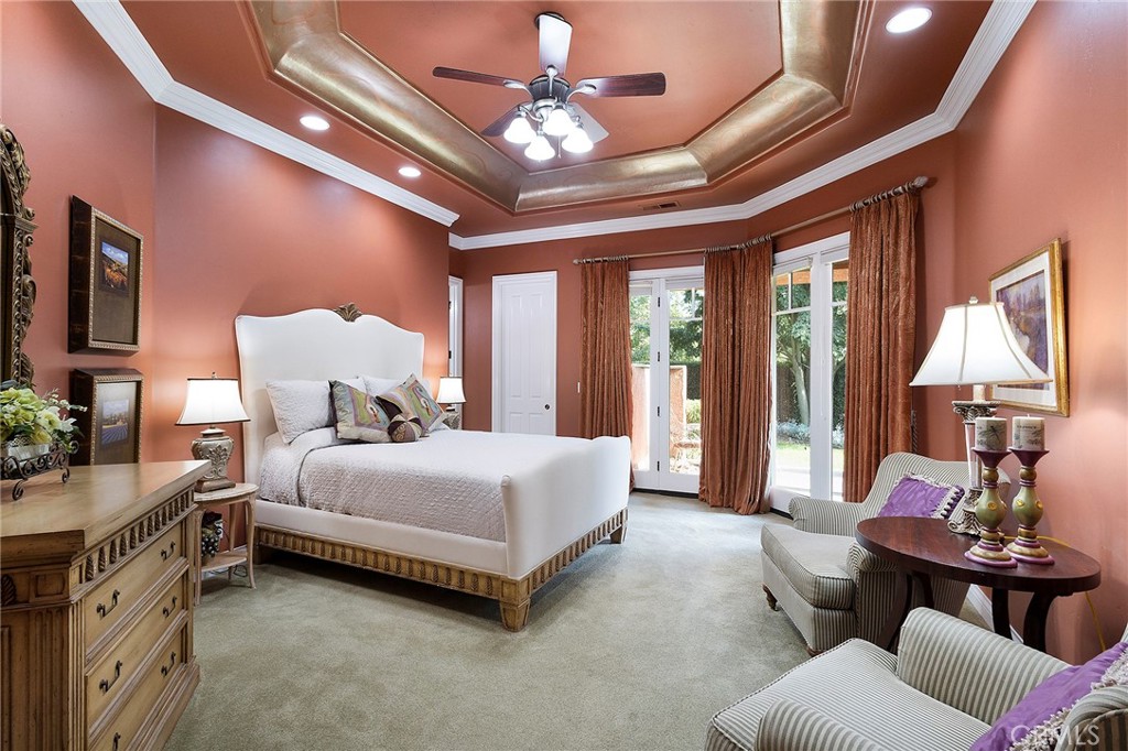 369 Marmore Road Chico, CA 95928 - Photo 26 of 62 a spacious bedroom with a bed couch chandelier and a window