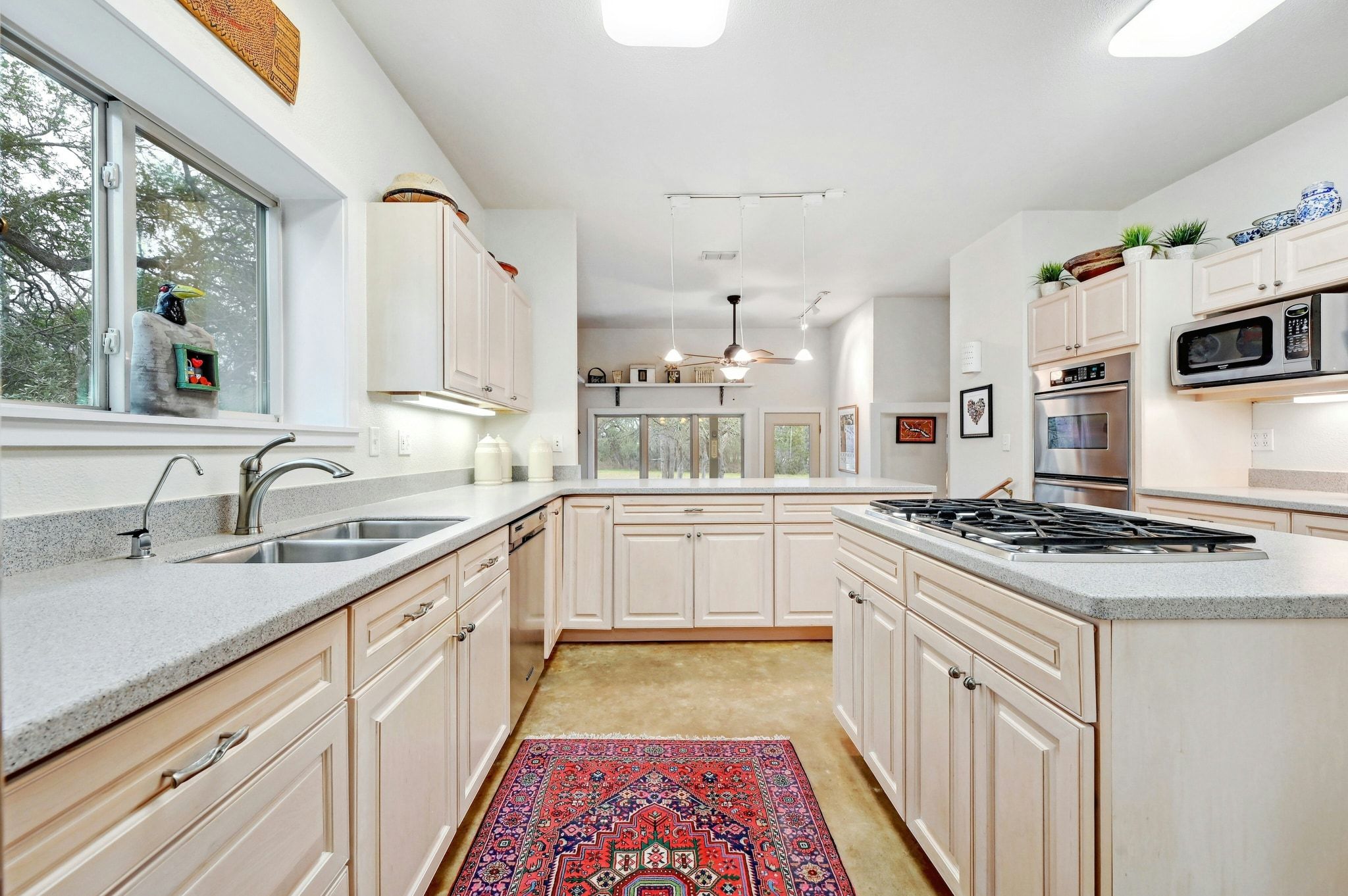 2147 Tejas Trail Blanco, TX 78606 - Photo 10 of 29 a white kitchen with sink and white stainless steel appliances