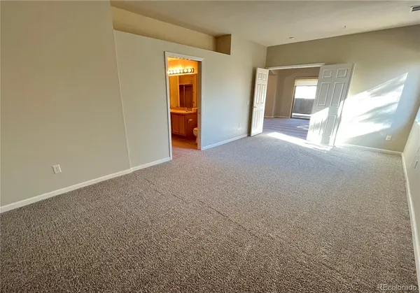 en empty room with windows