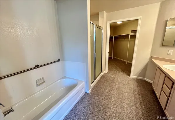 a bathroom with a double vanity sink a and mirror