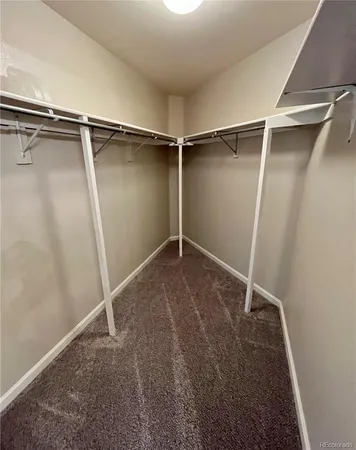 a view of an empty room with glass door