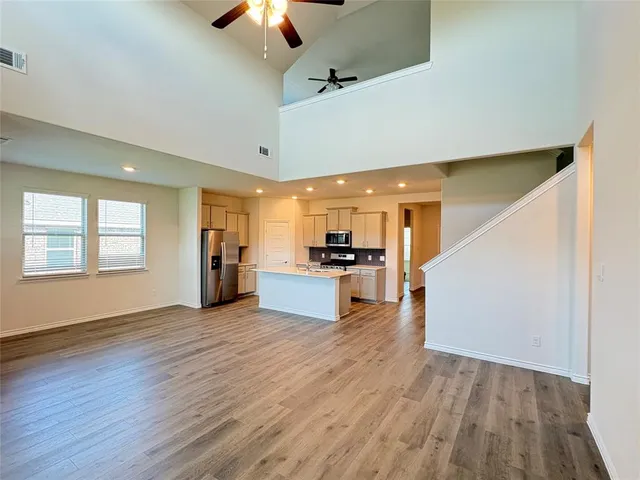 a view of kitchen with cabinets and wooden floor