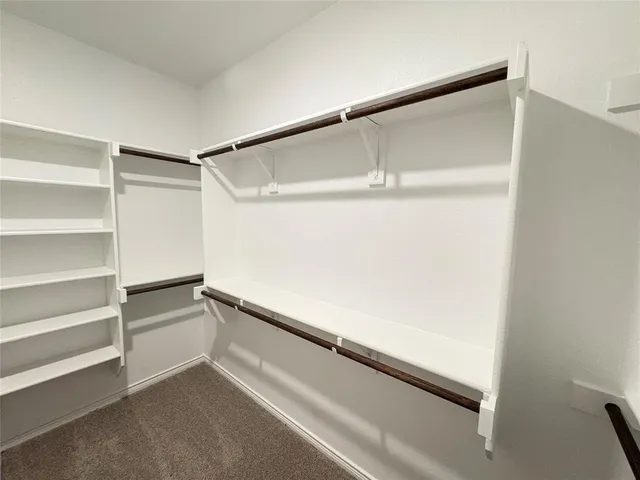 a view of an empty walk in closet
