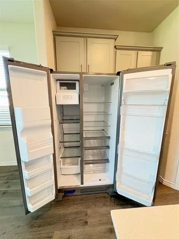 a view of an empty room with a balcony